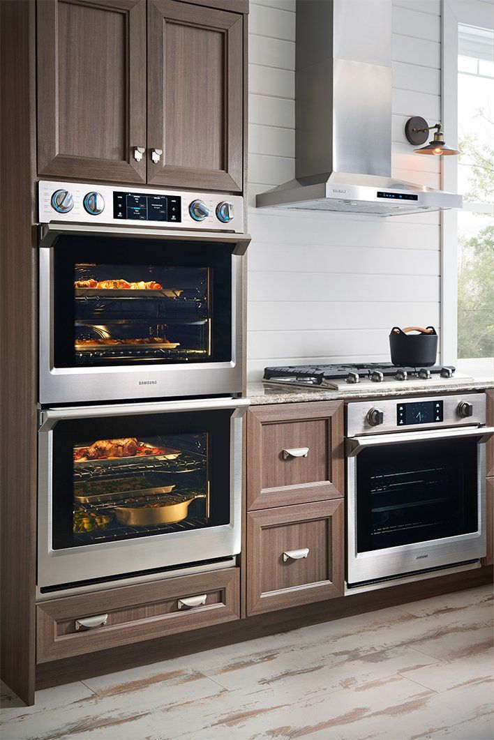 an image of a KitchenAid double wall oven set into kitchen cabinets.